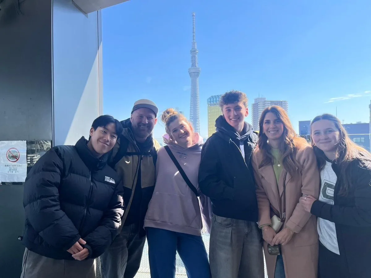 Walking view of Senso-ji temple area with Tokyo Skytree rising in the background