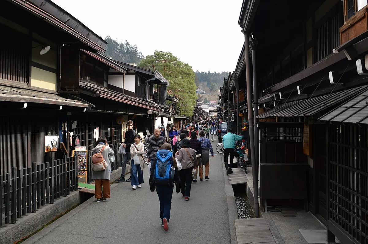 Traditional wooden shopfronts along Takayama's Kamisannomachi street